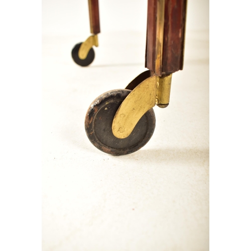 417 - An early 20th century circa 1900 mahogany & brass bound glazed cocktail drinks trolley. The trolley ... 