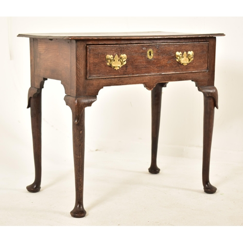 427 - A George III 18th century oak lowboy desk. The desk having single drawer to the frieze and with flar... 