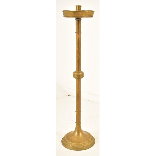 436 - A pair of late Victorian - early 20th century brass ecclesiastical church floor candle holders / pri... 