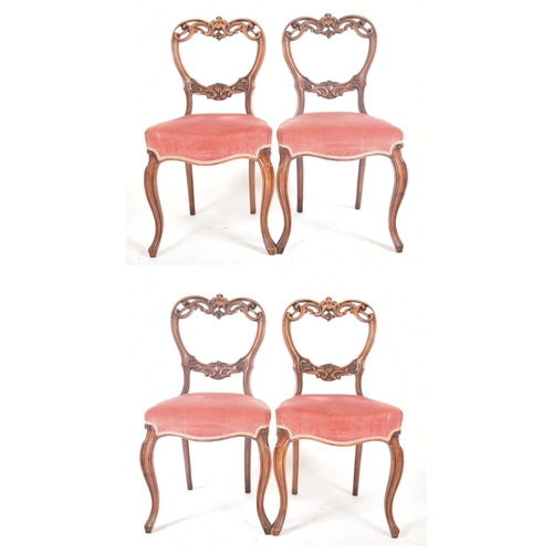 439 - A set of four late 19th century French continental carved walnut balloon back dining chairs. Each ch... 