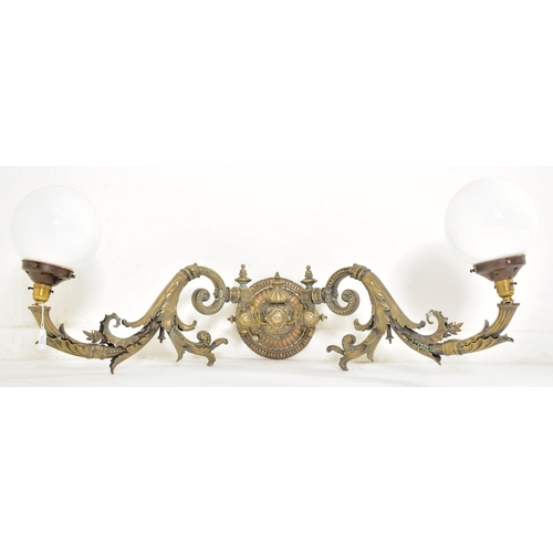 440 - An early 20th century circa 1900s French Art Nouveau cast metal twin arm wall light sconce. The ligh... 