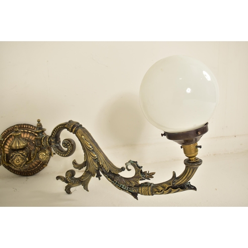 440 - An early 20th century circa 1900s French Art Nouveau cast metal twin arm wall light sconce. The ligh... 