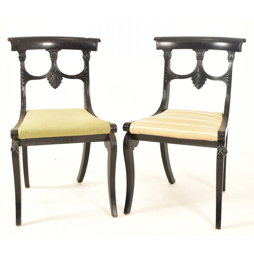 442 - A pair of Regency early 19th century ebonised wood dining chairs. Each chair having a curved top rai... 