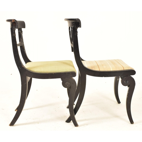 442 - A pair of Regency early 19th century ebonised wood dining chairs. Each chair having a curved top rai... 