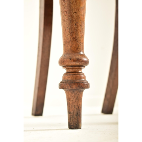 443 - A pair of Victorian 19th century carved oak round back hall chairs. Each chair having a pierced roun... 