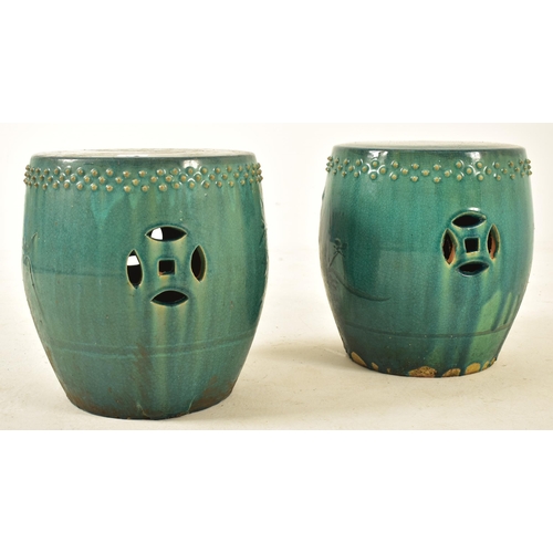 446 - A pair of Chinese green glazed terracotta garden patio stools seats. Each stool of barrel shape with... 