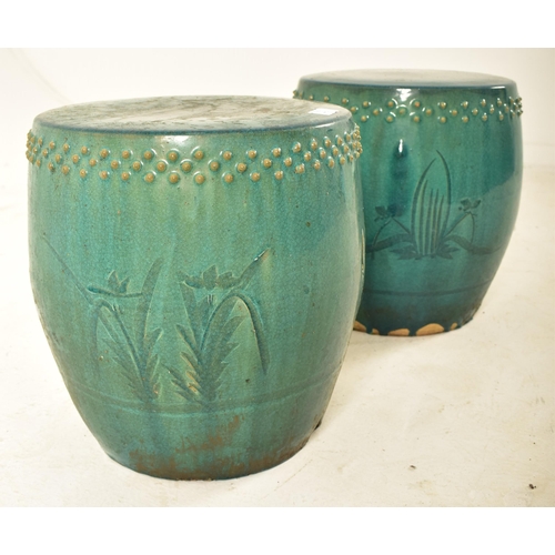 446 - A pair of Chinese green glazed terracotta garden patio stools seats. Each stool of barrel shape with... 