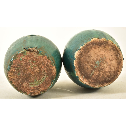 446 - A pair of Chinese green glazed terracotta garden patio stools seats. Each stool of barrel shape with... 