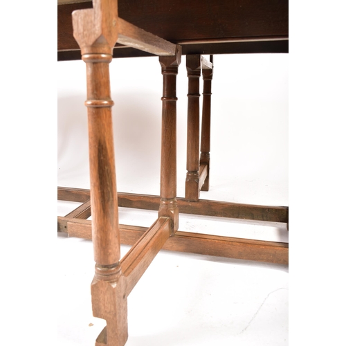 448 - An Irish manner large peg jointed solid oak wake dining table. The large table raised on block and t... 