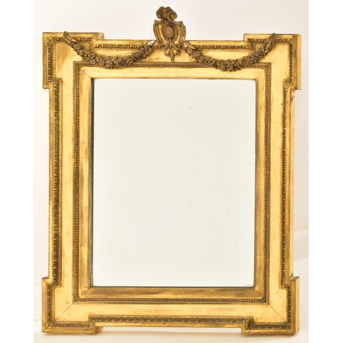 451 - A 19th century Adams revival gilt wood and gesso worked wall hanging mirror. Harebell swag with
 arm... 