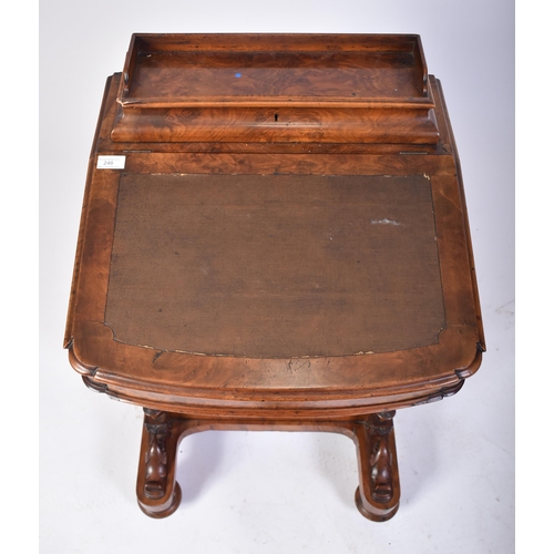 457 - A 19th century Victorian walnut Davenport desk. The desk with carved columns to the front having a b... 