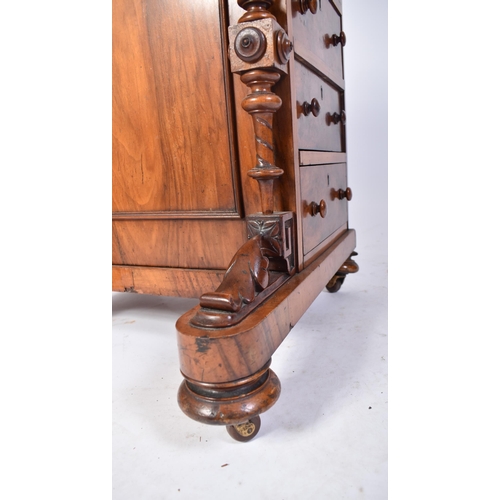 457 - A 19th century Victorian walnut Davenport desk. The desk with carved columns to the front having a b... 