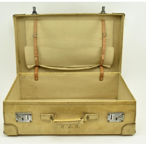 459 - A pair of 20th century pig skin leather travelling suitcases. Each suitcase of rectangular form with... 