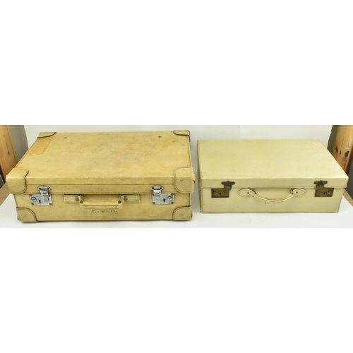 459 - A pair of 20th century pig skin leather travelling suitcases. Each suitcase of rectangular form with... 