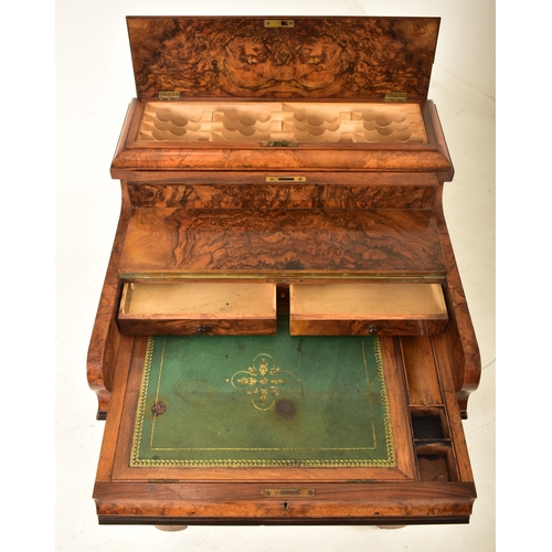 462 - A Victorian 19th century figured walnut veneered piano top Davenport writing desk. The desk having a... 