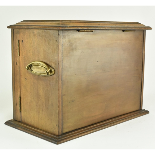 464 - An Edwardian 1912 carved oak smokers / tobacco compendium cabinet. The cabinet having a hinged cover... 