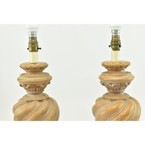 472 - A pair of Classical inspired resin wooden effect desk table lamps. Each lamp having a reeded turned ... 