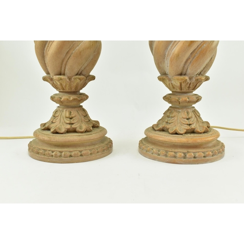 472 - A pair of Classical inspired resin wooden effect desk table lamps. Each lamp having a reeded turned ... 