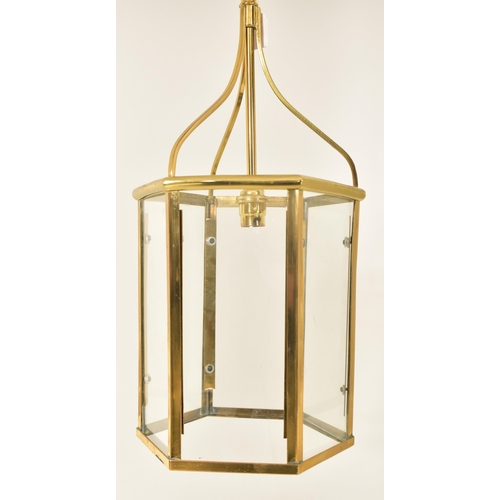 479 - A George III Revival brass & glass hexagonal hall porch ceiling lantern light. The light having bent... 