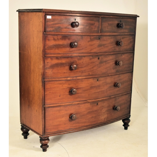 486 - A 19th century mahogany bow fronted chest of drawers. The chest having a chamfered edge top over two... 