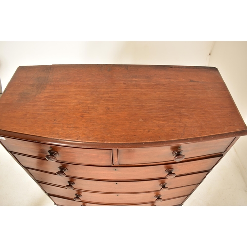 486 - A 19th century mahogany bow fronted chest of drawers. The chest having a chamfered edge top over two... 