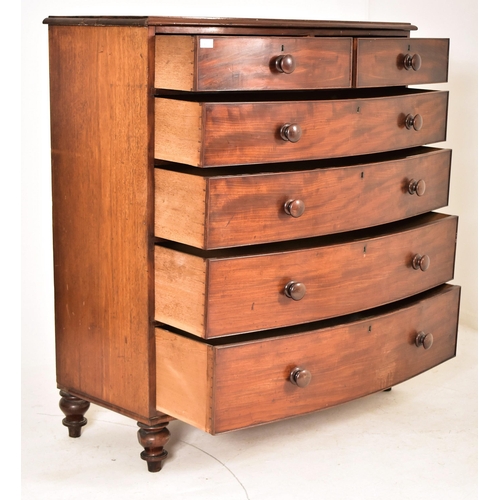 486 - A 19th century mahogany bow fronted chest of drawers. The chest having a chamfered edge top over two... 