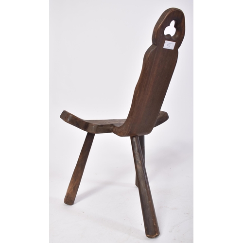 488 - A late 19th century Brutalist elm wood birthing milking tripod stool / chair. The stool having a han... 