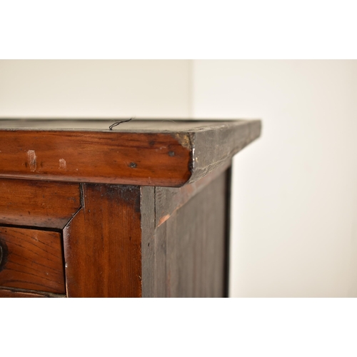 491 - A Japanese early 20th century hardwood upright cupboard cabinet. The cabinet having a flared top ove... 