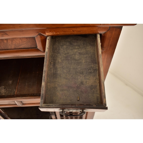 491 - A Japanese early 20th century hardwood upright cupboard cabinet. The cabinet having a flared top ove... 