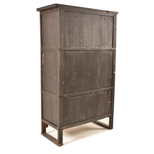 491 - A Japanese early 20th century hardwood upright cupboard cabinet. The cabinet having a flared top ove... 