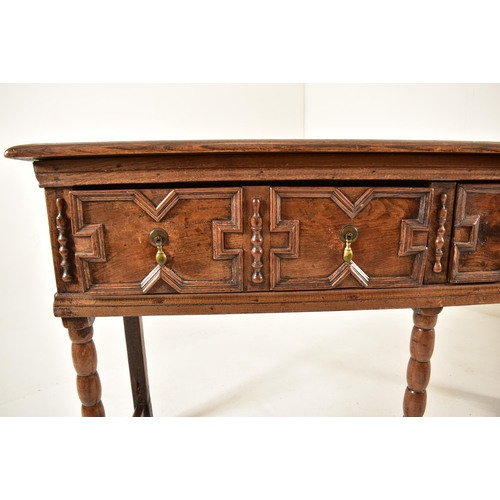 498 - A Jacobean 18th century oak block fronted dresser credenza of small proportions. The dresser having ... 