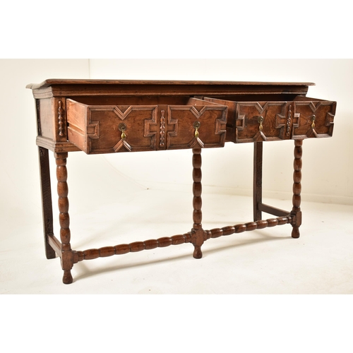 498 - A Jacobean 18th century oak block fronted dresser credenza of small proportions. The dresser having ... 