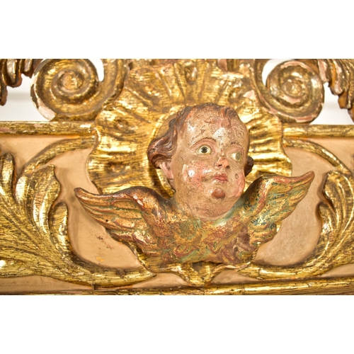 500 - A large continental 19th century Italian Rococo inspired gilt wood wall mirror. The mirror having an... 