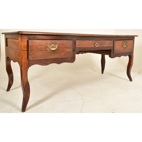 611 - A large French continental 19th century chestnut wood writing office desk. The desk having a rectang... 