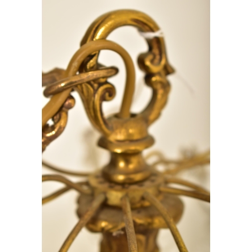 613 - A continental inspired early 20th century 1920s style gilded solid brass six arm ceiling chandelier.... 