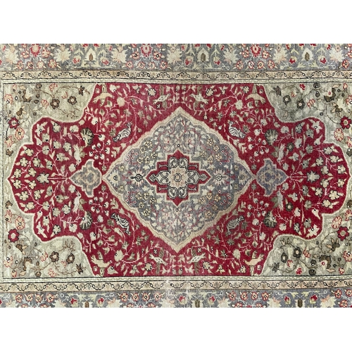 463 - A late 19th century Turkish Islamic Kayseri hand woven floor carpet rug. The rug having a a central ... 