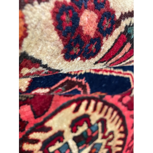 477 - A 20th century North West Persian Islamic Tafresh floor carpet rug. The rug having a central red, bl... 