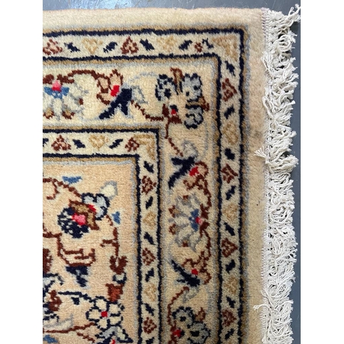 483 - An early 20th century Central Persian Islamic Kashan floor carpet rug. The rug having a cream ground... 