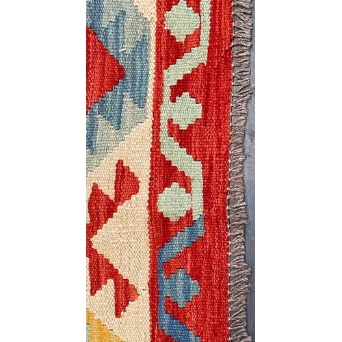 543 - A 20th century Anatolian Turkish Islamic Kilim floor carpet rug. The rug having a central cream pane... 