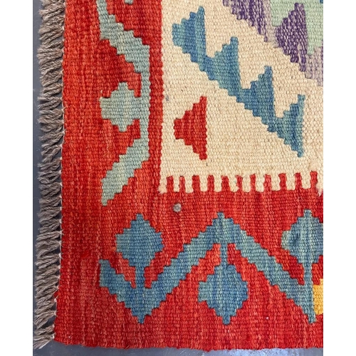 543 - A 20th century Anatolian Turkish Islamic Kilim floor carpet rug. The rug having a central cream pane... 