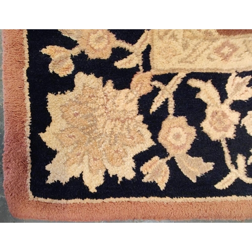 592 - A 20th century Persian Afghan floor carpet rug. The rug having a central red panel with cream floral... 