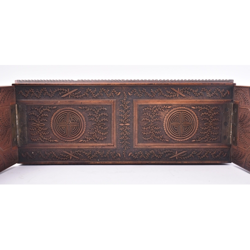 223 - A 19th century Chinese Cantonese carved wood book slide. The slide intricately carved throughout scr... 