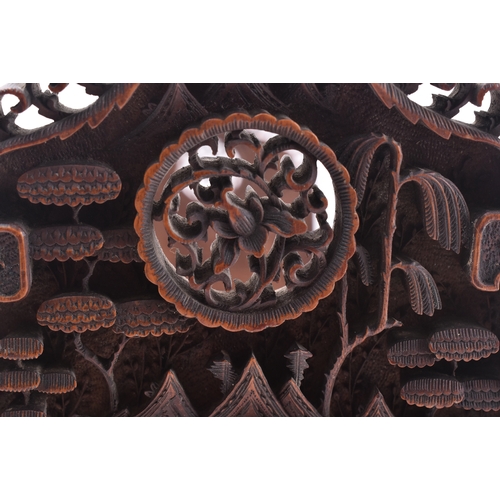 223 - A 19th century Chinese Cantonese carved wood book slide. The slide intricately carved throughout scr... 