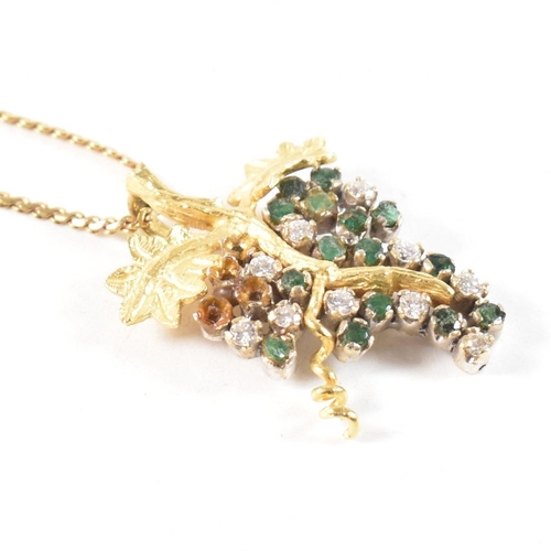 154 - An 18ct gold, emerald and diamond grapevine pendant necklace. The 18ct gold grapevine pendant set wi... 