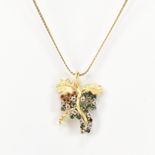 154 - An 18ct gold, emerald and diamond grapevine pendant necklace. The 18ct gold grapevine pendant set wi... 