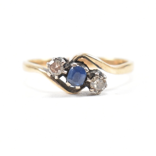 181 - An 18ct yellow gold, sapphire and diamond three stone crossover ring. The ring having a central oval... 