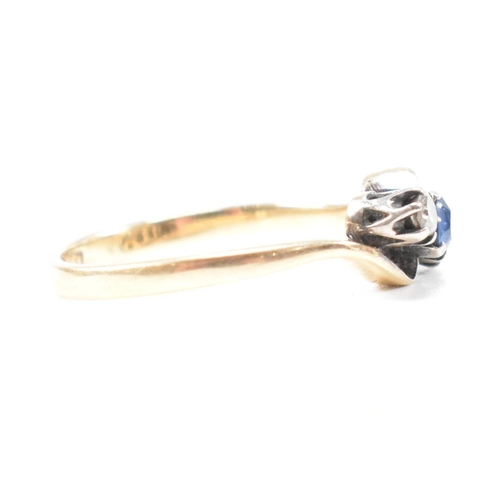 181 - An 18ct yellow gold, sapphire and diamond three stone crossover ring. The ring having a central oval... 