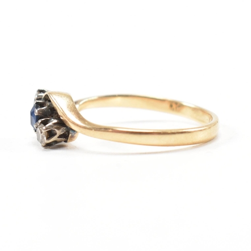 181 - An 18ct yellow gold, sapphire and diamond three stone crossover ring. The ring having a central oval... 