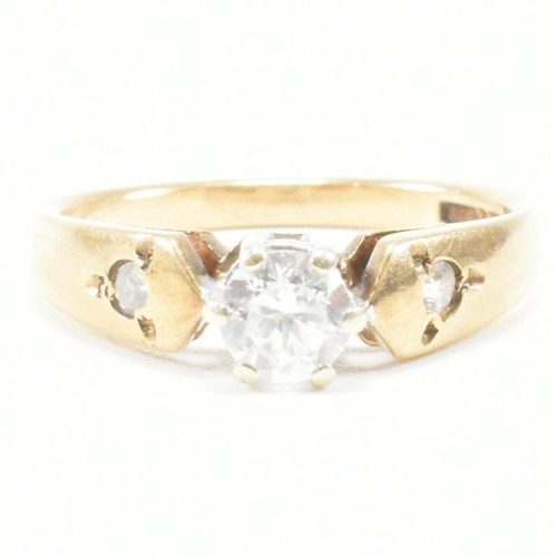 182 - A hallmarked 9ct yellow gold and cubic zirconia engagement style ring. The ring having a round cut w... 