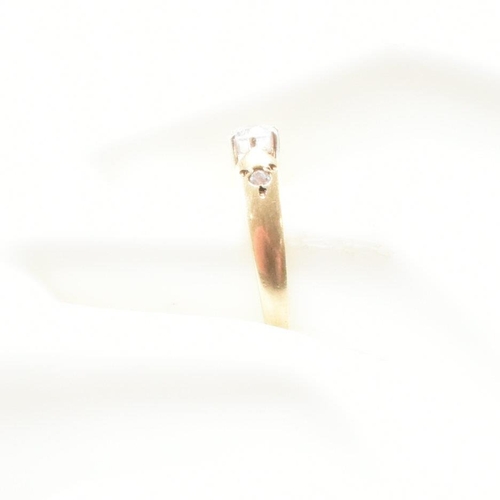 182 - A hallmarked 9ct yellow gold and cubic zirconia engagement style ring. The ring having a round cut w... 